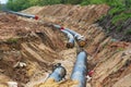Gas pipeline under construction. Black pipes buried in the ground