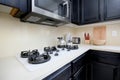 gas-powered range, appliance, microwave, in kitchen corner