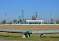 Gas Processing Plant. Power pipes and industrial refinery towers of natural gas factory on the background blue sky. Oil drill rig Royalty Free Stock Photo