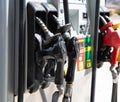 Gas pump nozzles at gasoline station Royalty Free Stock Photo