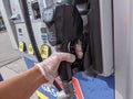 Gas pumps with gloves for protection