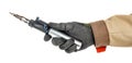 Gas soldering iron in electrician hand in black protective glove and brown uniform isolated on white background Royalty Free Stock Photo
