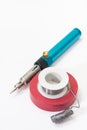 Gas soldering iron with tin and insulating tape Royalty Free Stock Photo