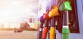 Gas station for a car. Column with fuel pistols close-up with lights effects. Long banner with white background