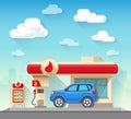 Gas station and car in front of cloudy sky