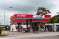 Gas station Cepsa brand with logo signage under cloudy sky in Gijon, Spain