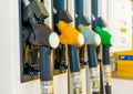 Gas station with four multi-colored handles close-up