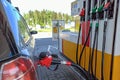 Gas station gun in the tank of the car. I need to fill up the gas tank Royalty Free Stock Photo