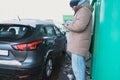 In a gas station, a man puts gas in his car and fills it up Royalty Free Stock Photo