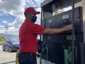 A gas station worker with in PDVSA state owned enterprise Petroleum of Venezuela oil and gas company in Caracas, Venezuela