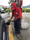 A gas station worker with in PDVSA state owned enterprise Petroleum of Venezuela oil and gas company in Caracas, Venezuela