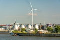 Gas storage reservoir and large wind turbine in the harbour area in Hamburg, Germany Royalty Free Stock Photo