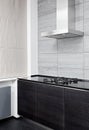 Gas stove and cooking hood on modern kitchen Royalty Free Stock Photo