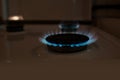 Gas stove with fire, close-up side view of flame, natural gas at home for cooking food, concept of environmental problems of gas Royalty Free Stock Photo