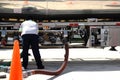 Gas tanker worker checking the valves