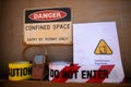 Gas test leak atmosphere confined space warning sign permit entry by permit only and red barricade danger tape Royalty Free Stock Photo