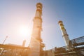 Gas turbine power plant on natural gas with chimneys of red-white color against a blue sky on a sunny day Royalty Free Stock Photo