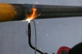 Gas welding metal pipe by gas burner