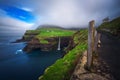 Gasadalur village and Mulafossur waterfall on Faroe Islands, Denmark Royalty Free Stock Photo