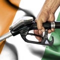 Gasoline consumption concept - Hand holding hose against flag of Ivory Coast Royalty Free Stock Photo