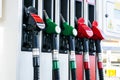 Gasoline and diesel distributor at the gas station. Gas pump nozzles. Petrol filling gun close-up at the gas station. Colorful Pet Royalty Free Stock Photo