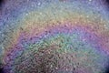 Gasoline that had leaked onto a wet parking lot creates a rainbow oil slick .