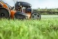 Lawn mower cutting grass Royalty Free Stock Photo