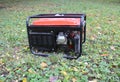 Gasoline Portable Generator. Close up on Mobile Backup Generator in the garden. Standby Generator - Outdoor Power Equipment