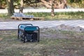 Gasoline portable generator on the street. Close up on mobile backup generator