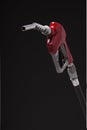 Gasoline pump nozzle with red vinyl covered handle isolated on b Royalty Free Stock Photo