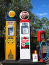 Gasoline pumps and tireflator, vintage items at Australian service station