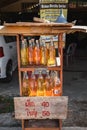 Gasoline sold in used glass bottles roadside in Ko Lanta, Krabi, Thailand