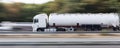 Gasoline transportation truck on highway speed blur Royalty Free Stock Photo