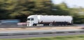 Gasoline transportation truck on highway speed blur Royalty Free Stock Photo