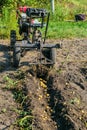 Gasoline walk-behind tractor with plow potato digger