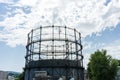 Gasometer old industry heritage with sky and tree Royalty Free Stock Photo