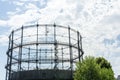 Gasometer old industry heritage with sky and tree Royalty Free Stock Photo