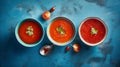 Gaspacho soup on blue tabletop. Three bowls of traditional spanish cold soup gazpacho Generative AI