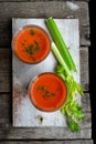 Gaspacho soup - Spanish tomato soup in glasses, ingredients on wooden rustic background Royalty Free Stock Photo