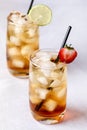 Gasses of Cold Citrus and Strawberry Ice Tea Decorated with Slice of Lemon and Strawberry Healthy Summer Drink Vertical