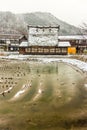 Gassho-style houses and rice field at Shirakawa-go in winter Royalty Free Stock Photo