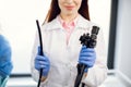 Cropped close up shot of female doctor holding modern endoscope device Royalty Free Stock Photo