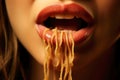 Gastronomic delight: close up of female\'s mouth with spaghetti