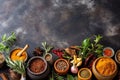 Gastronomic delight, spices and herbs arranged on stone table copy space