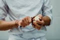 Gastronomic student peeling apples for apple pie Royalty Free Stock Photo