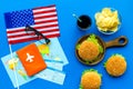 Gastronomical tourism with american flag, passport, tickets, map, burgers, chips, drink on blue background top view Royalty Free Stock Photo