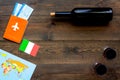 Gastronomical tourism. Italian food symbols. Passport and tickets near italian flag, bottle of red wine, map of the Royalty Free Stock Photo