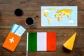 Gastronomical tourism. Italian food symbols. Passport and tickets near italian flag, glass of red wine, map of the world Royalty Free Stock Photo