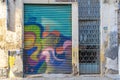 gate of abandoned shop with vandalism paintings in the capital Nicosia Lefkosia in Northern Cyprus, September 2023