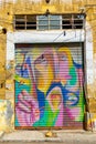 gate of abandoned shop with vandalism paintings in the capital Nicosia Lefkosia in Northern Cyprus, September 2023.